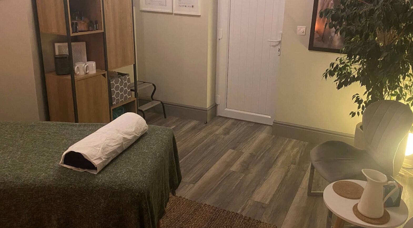 Cozy therapy room at Albion Massage Therapy, Cambridge, England, GB, featuring a massage table and relaxing decor.