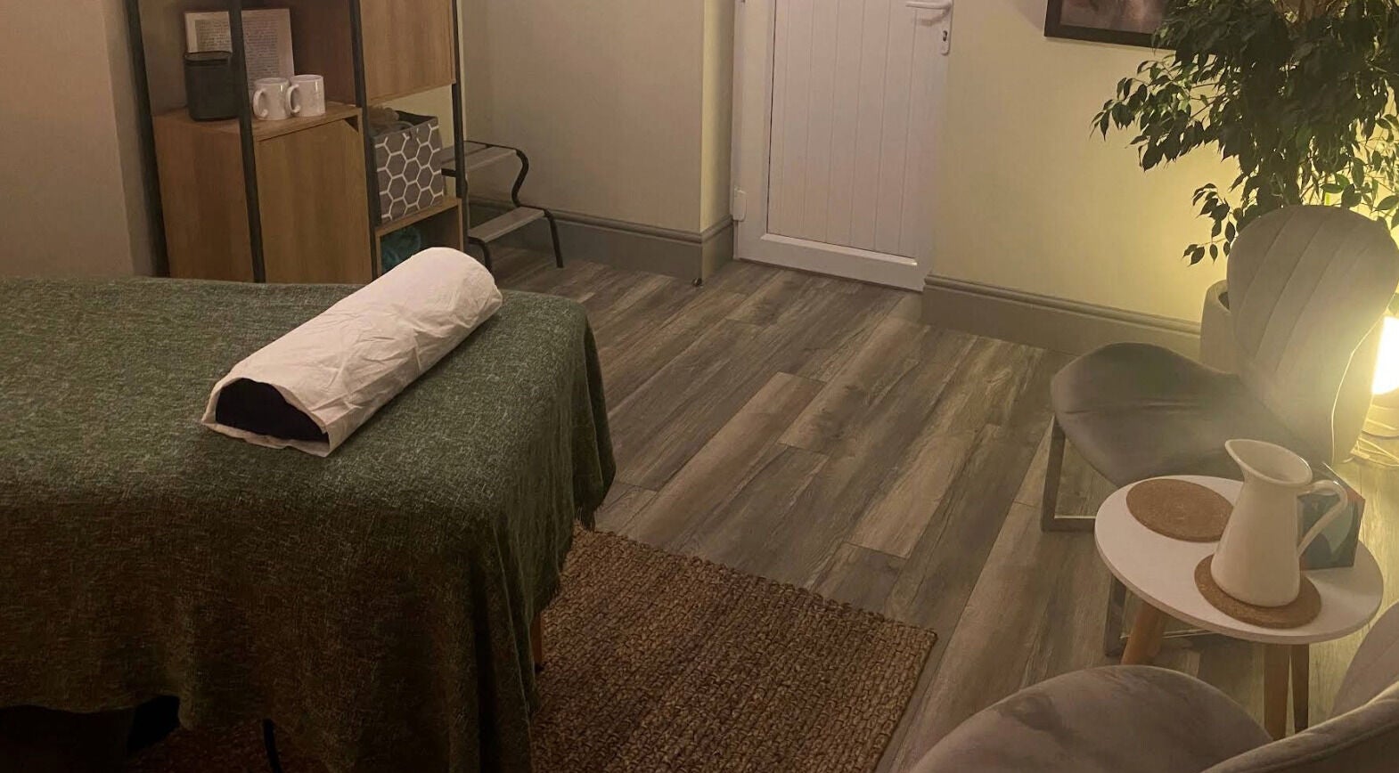 Calm therapy room at Albion Massage Therapy, Cambridge, England, GB with cozy lighting and modern decor.