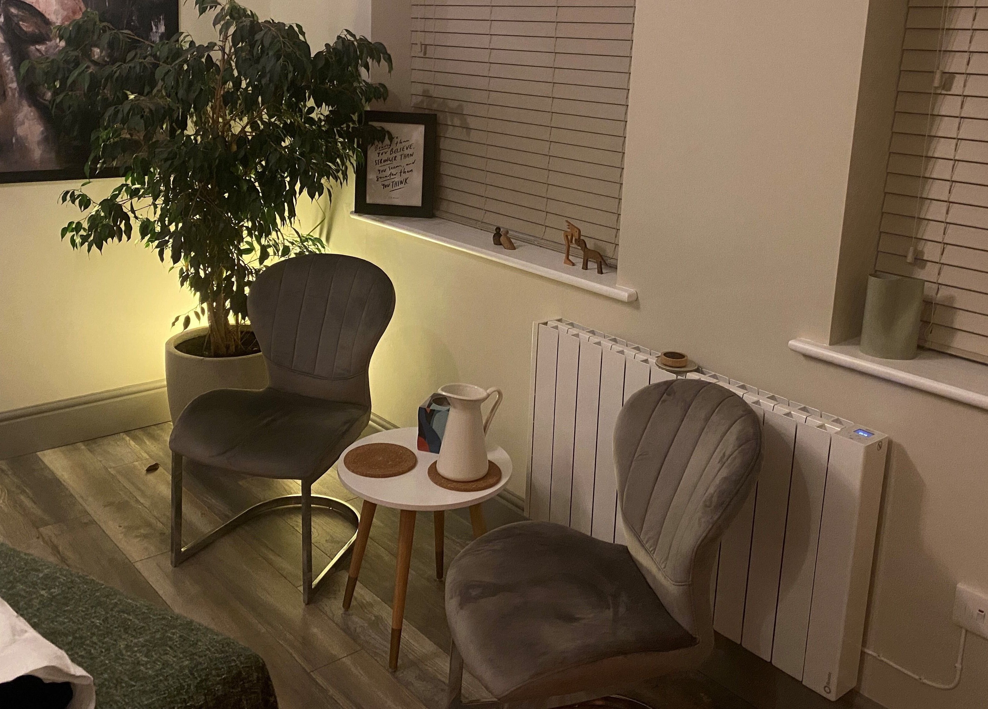 Cozy seating area with two chairs and a table at Albion Massage Therapy, Cambridge, England, GB.