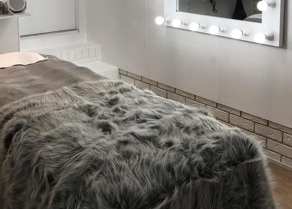 Cozy treatment room at Touch of Grace Lashes and Beauty in Lota, Queensland, AU with soft lighting.