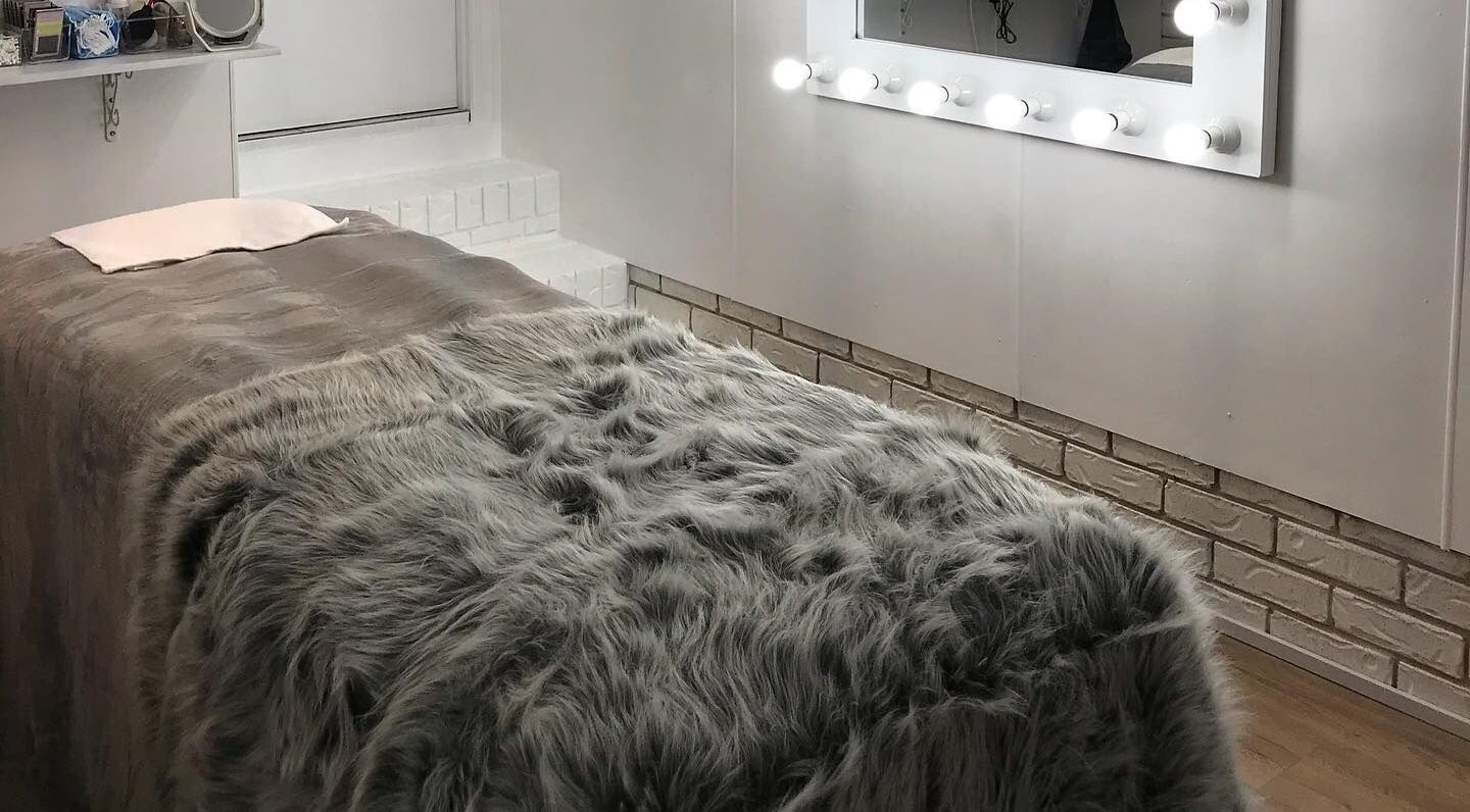 Cozy treatment room at Touch of Grace Lashes and Beauty in Lota, Queensland, AU with soft lighting.