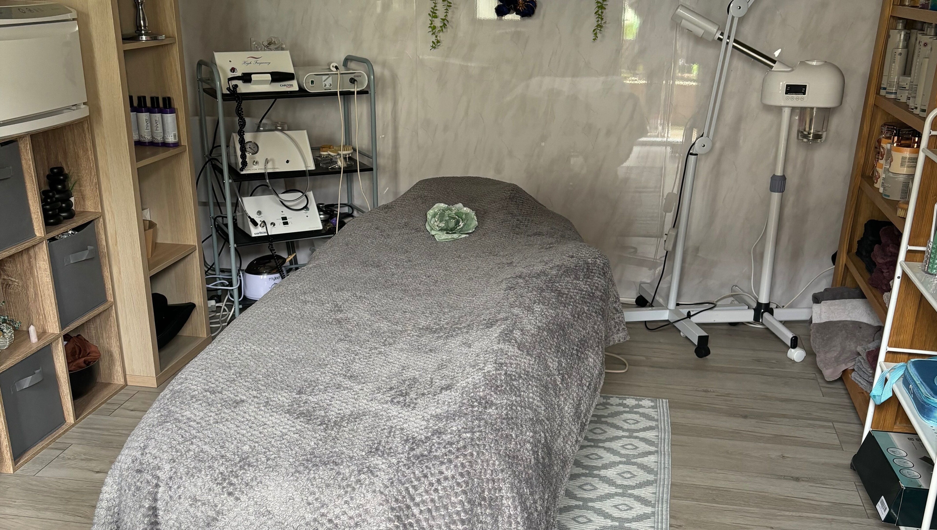 Calm treatment room at Kerridwen, Cardiff, Wales, GB with spa bed and relaxing decor.