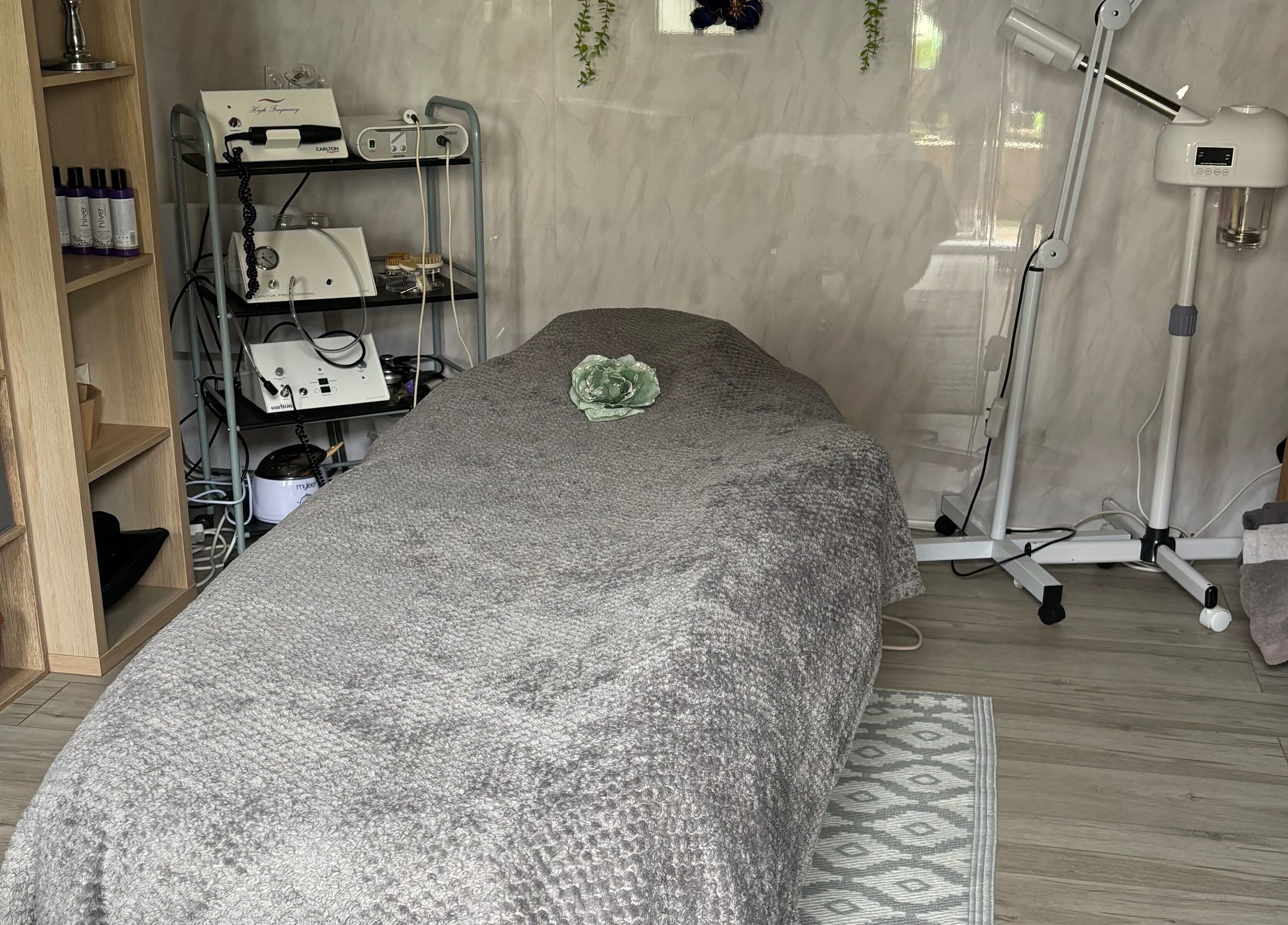 Calm treatment room at Kerridwen, Cardiff, Wales, GB with spa bed and relaxing decor.