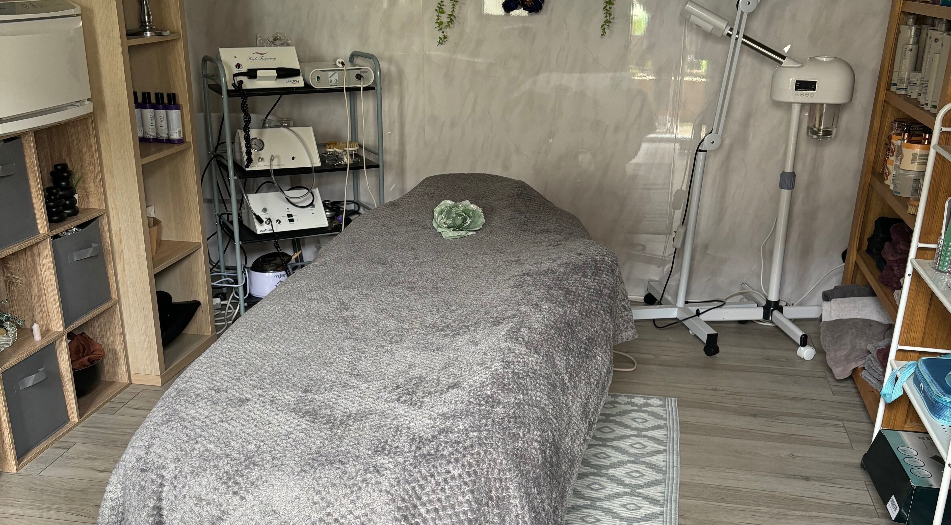 Calm treatment room at Kerridwen, Cardiff, Wales, GB with spa bed and relaxing decor.