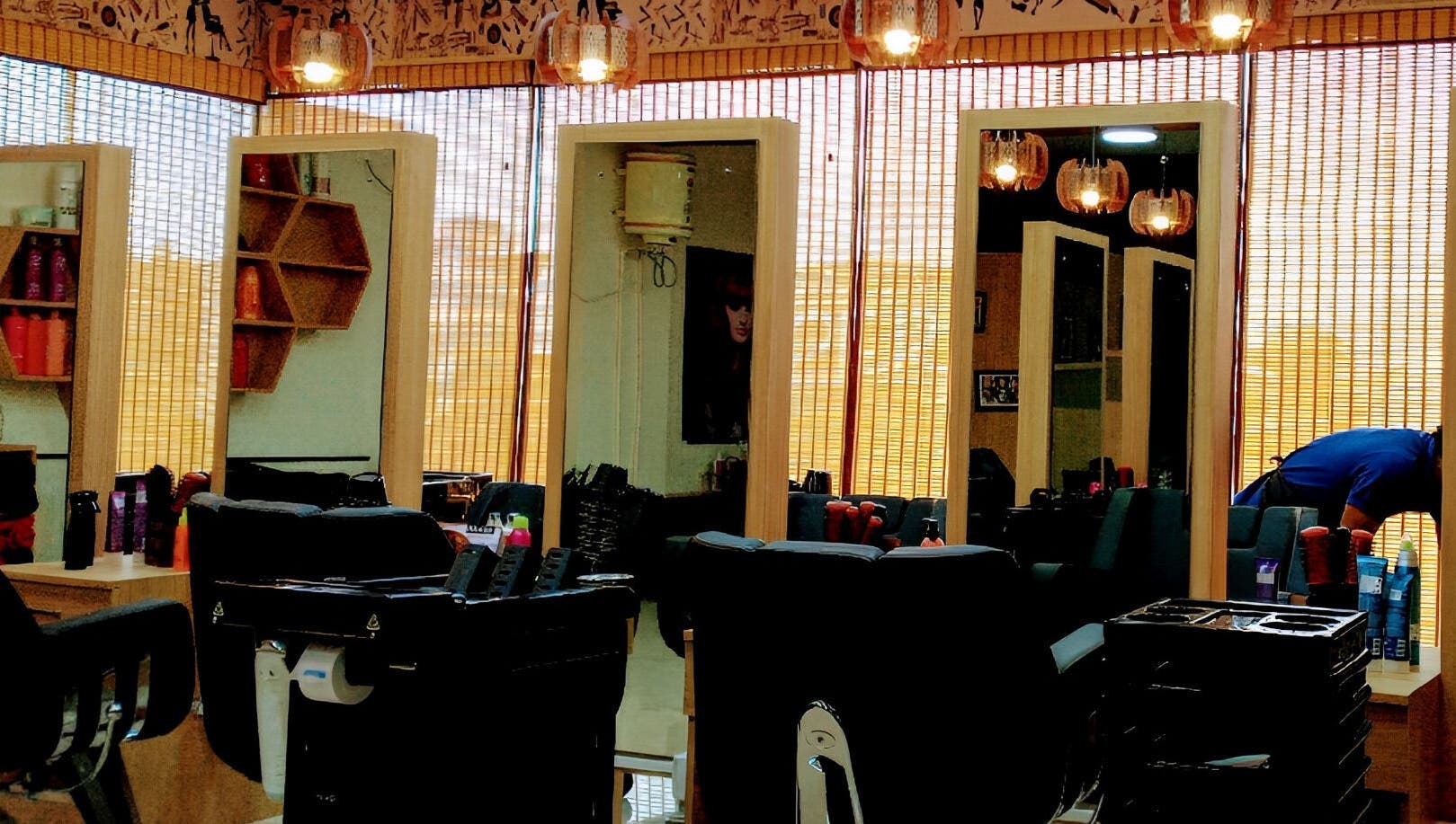 Stylish interior of Tropicurl Salon in Bengaluru, Karnataka, IN, showcasing modern mirrors and salon chairs.