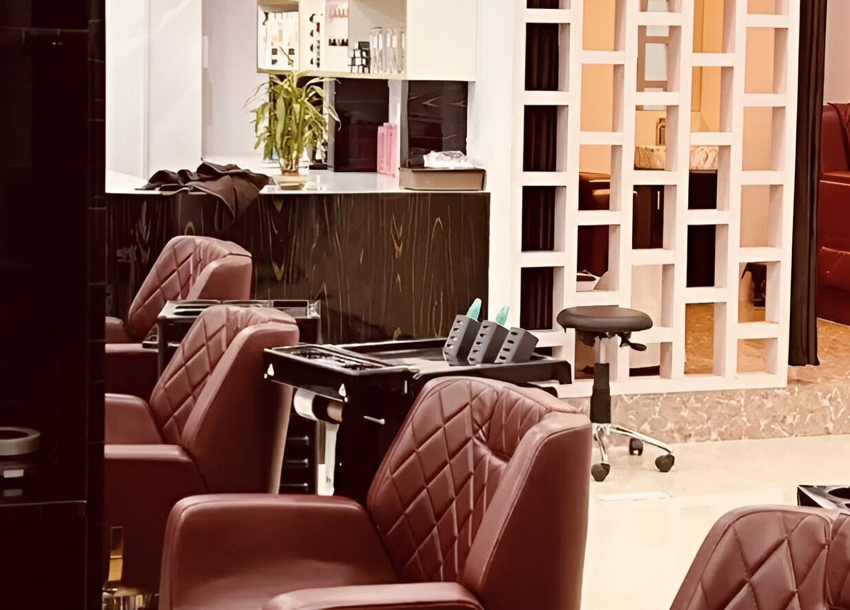 Interior of Tropicurl Salon in Bengaluru, Karnataka, IN showcasing luxurious seating and stylish decor.