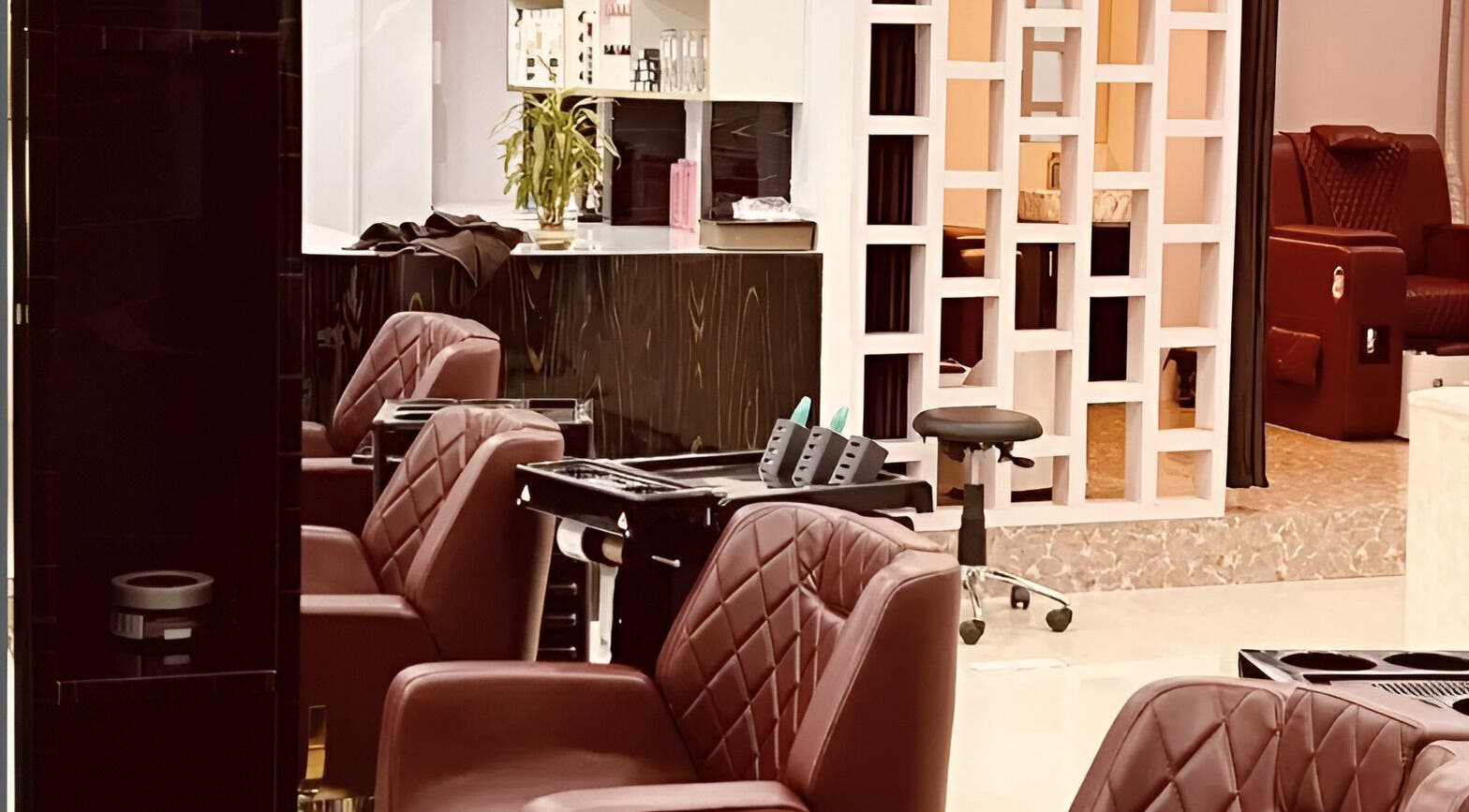 Interior of Tropicurl Salon in Bengaluru, Karnataka, IN showcasing luxurious seating and stylish decor.