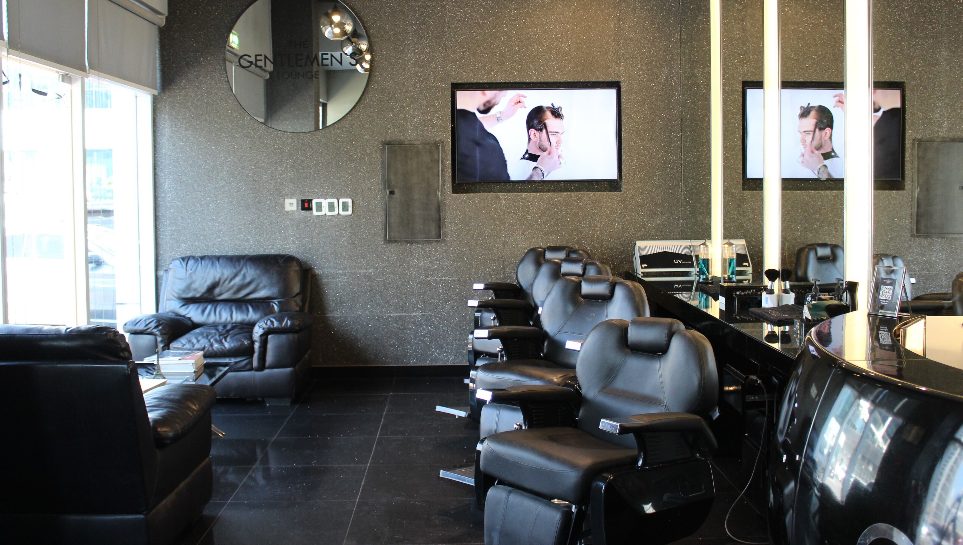 Elegant barber chairs at The Gentlemen's Lounge, Dubai, Dubai, AE, showcasing modern and sleek design.