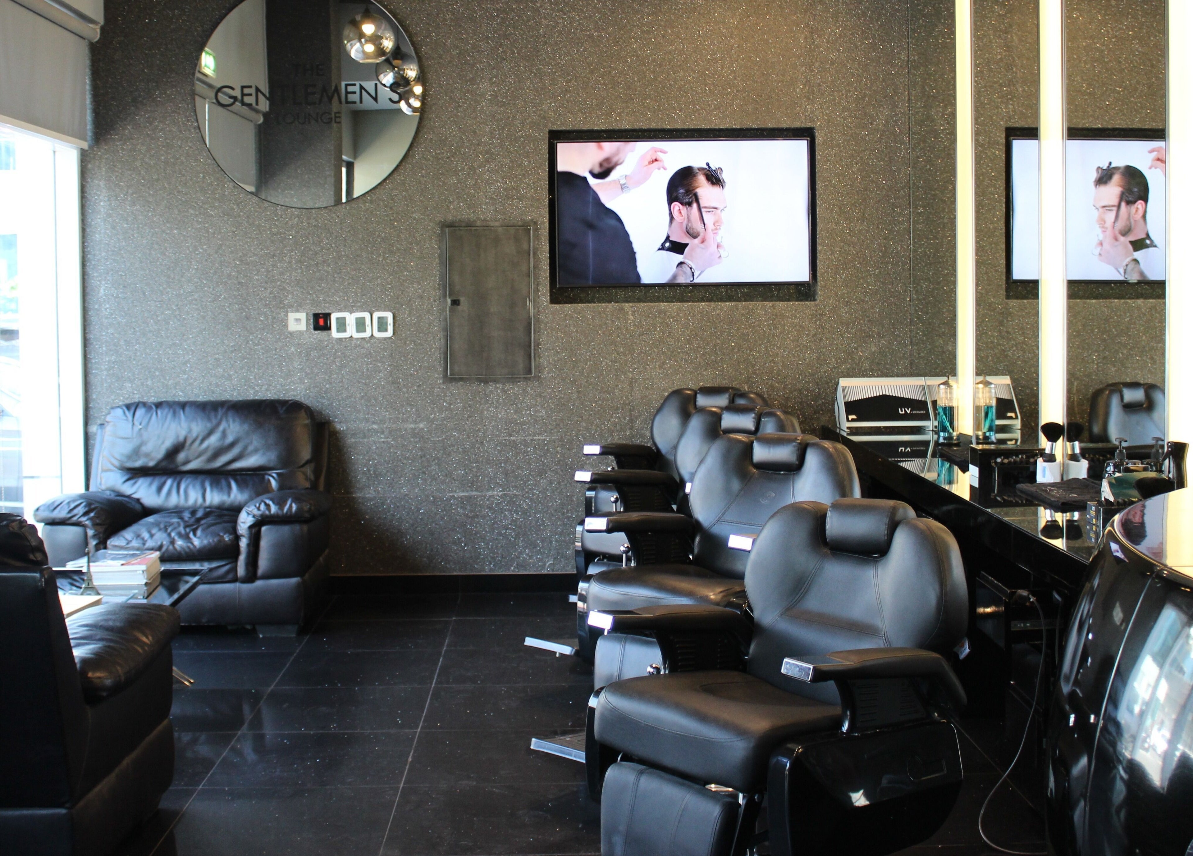 Elegant barber chairs at The Gentlemen's Lounge, Dubai, Dubai, AE, showcasing modern and sleek design.