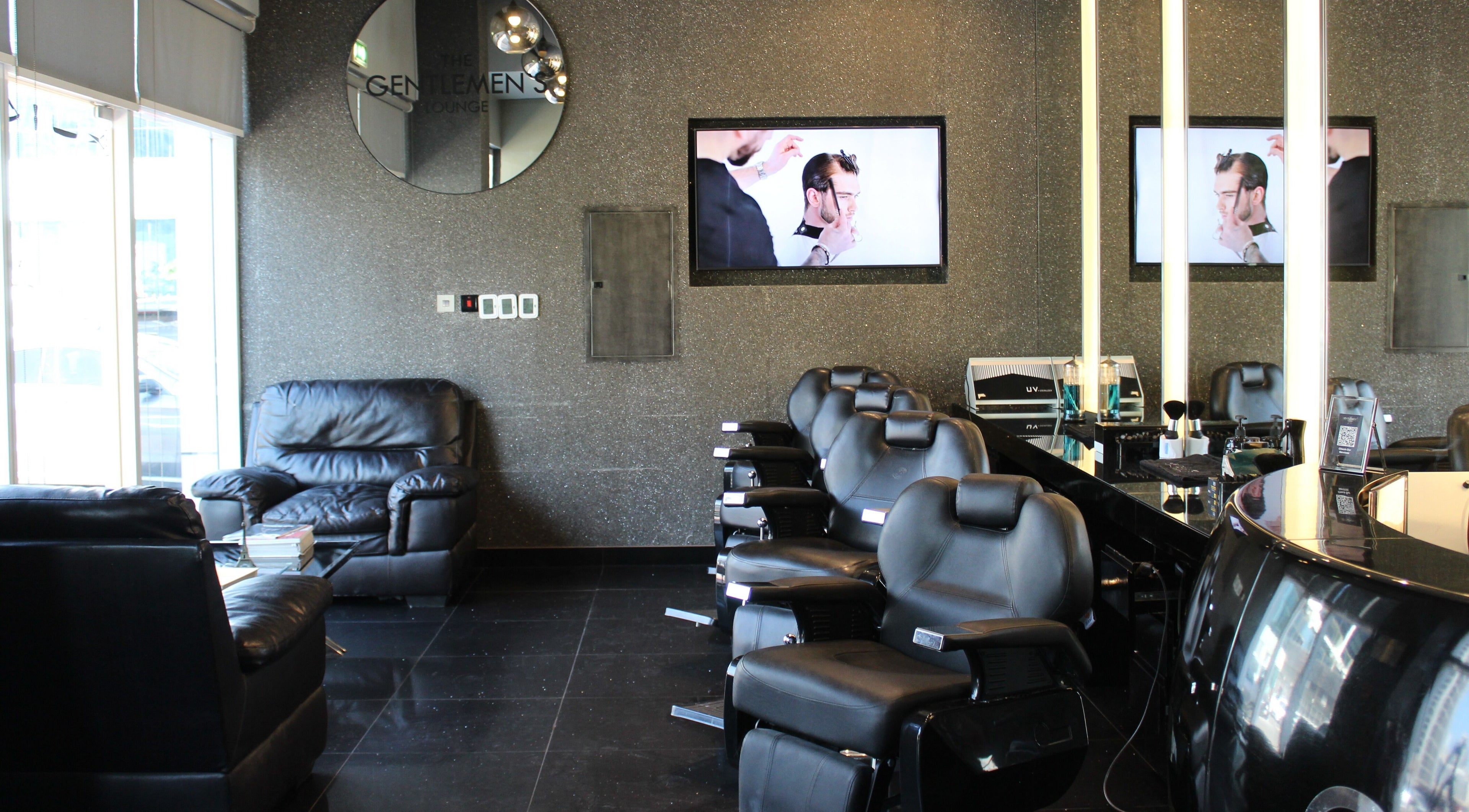 Elegant barber chairs at The Gentlemen's Lounge, Dubai, Dubai, AE, showcasing modern and sleek design.