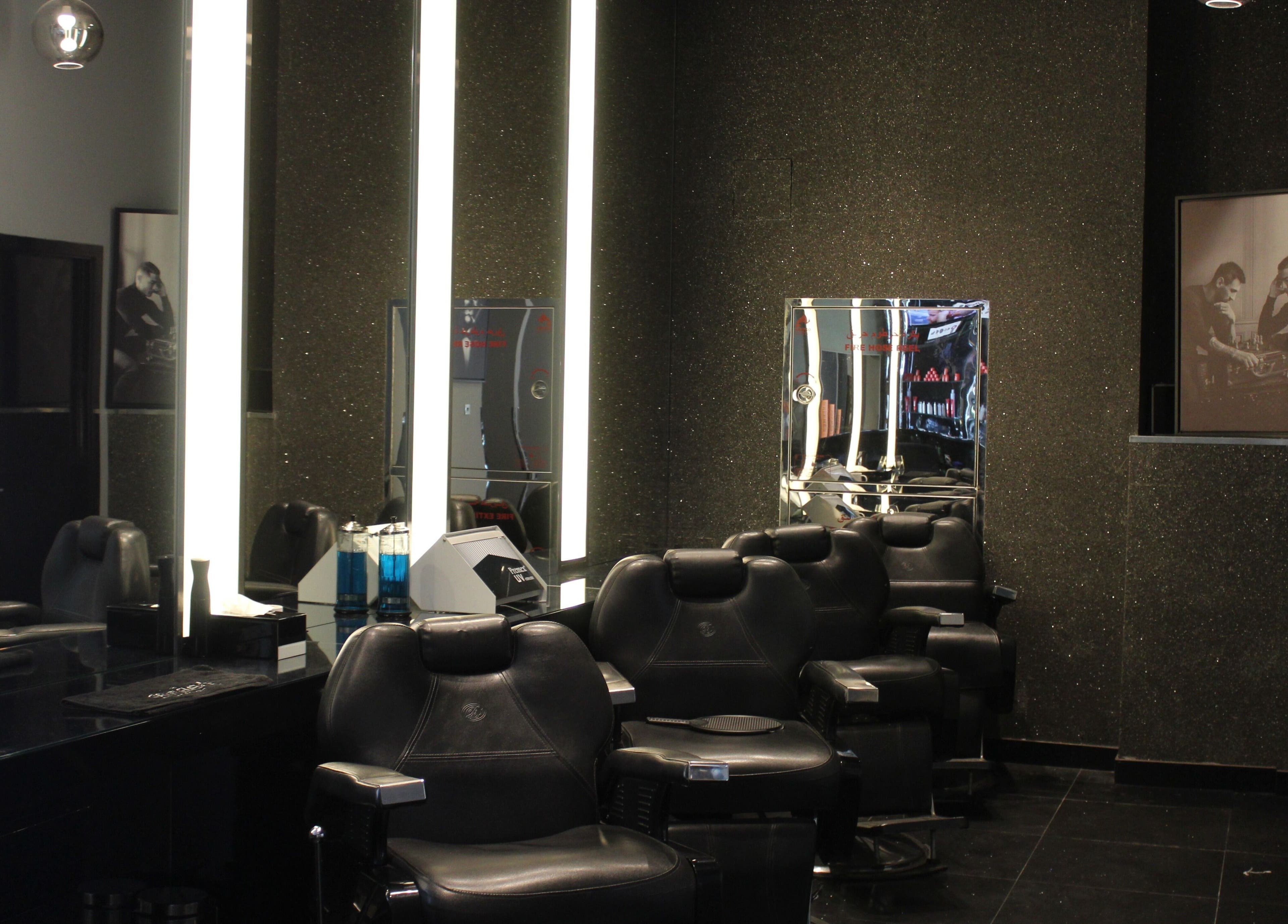 Elegant black barber chairs at The Gentlemen's Lounge, Dubai, Dubai, AE offer a stylish grooming experience.