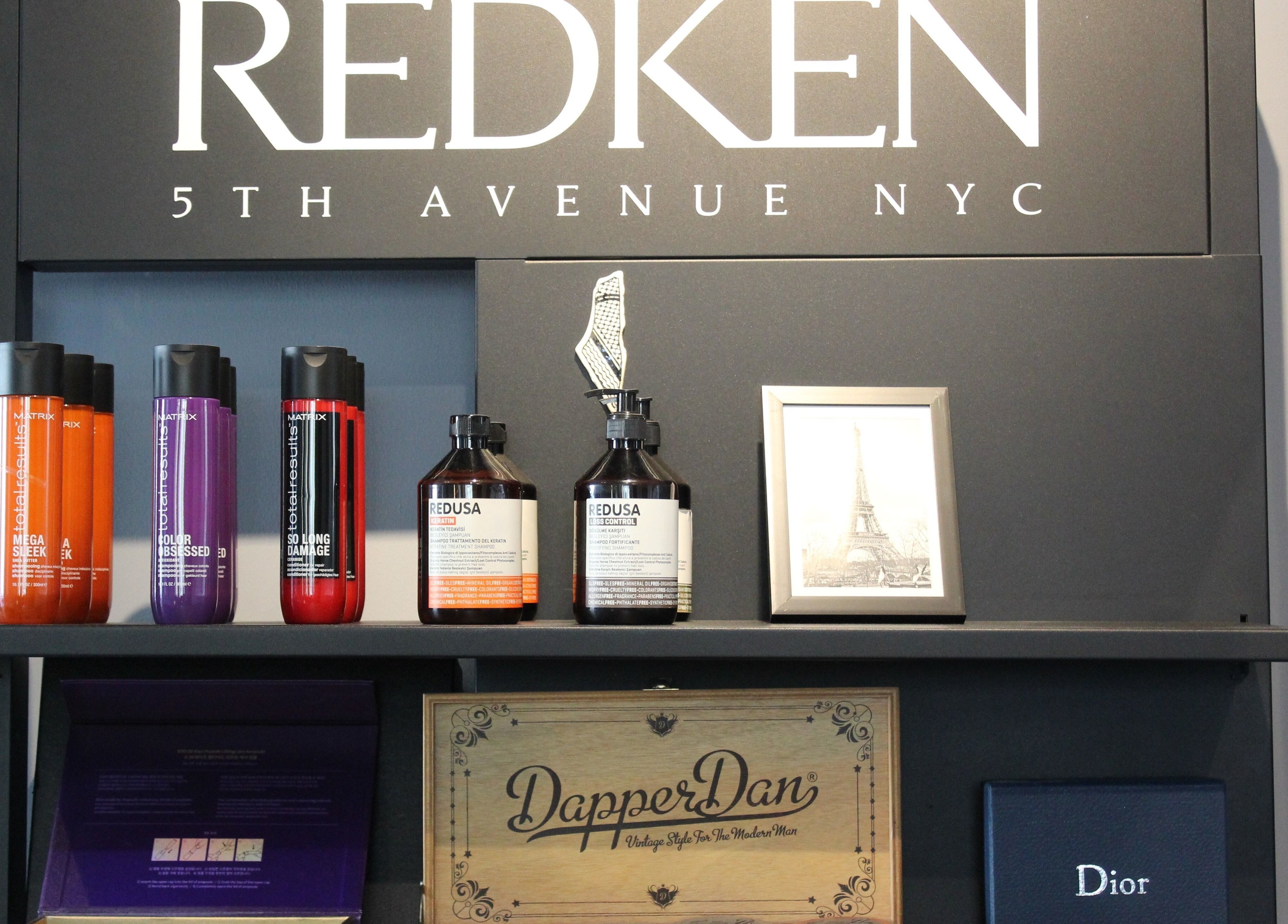 Luxurious product display at The Gentlemen's Lounge in Dubai, Dubai, AE featuring Redken and Dior items.