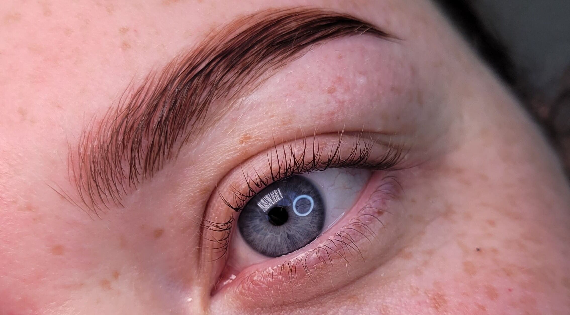 Close-up of expertly shaped eyebrows by Alex Kim MUA in Melbourne, Victoria, AU.