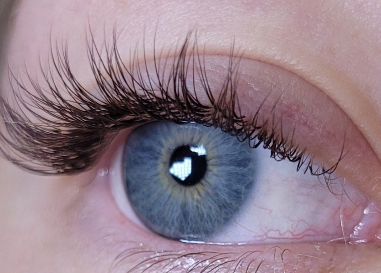 Close-up of enhanced eyelashes at Alex Kim MUA, Melbourne, Victoria, AU, showcasing expert beauty work.