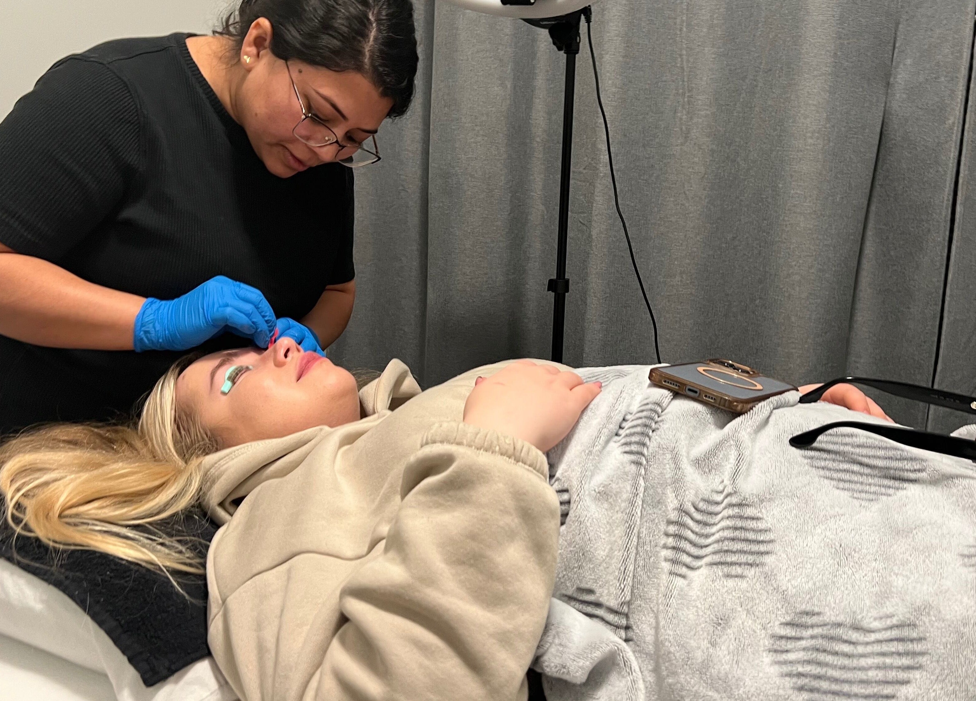 Professional esthetician applying treatment to client at Bala Esthetics Inc., Edmonton, Alberta, CA.