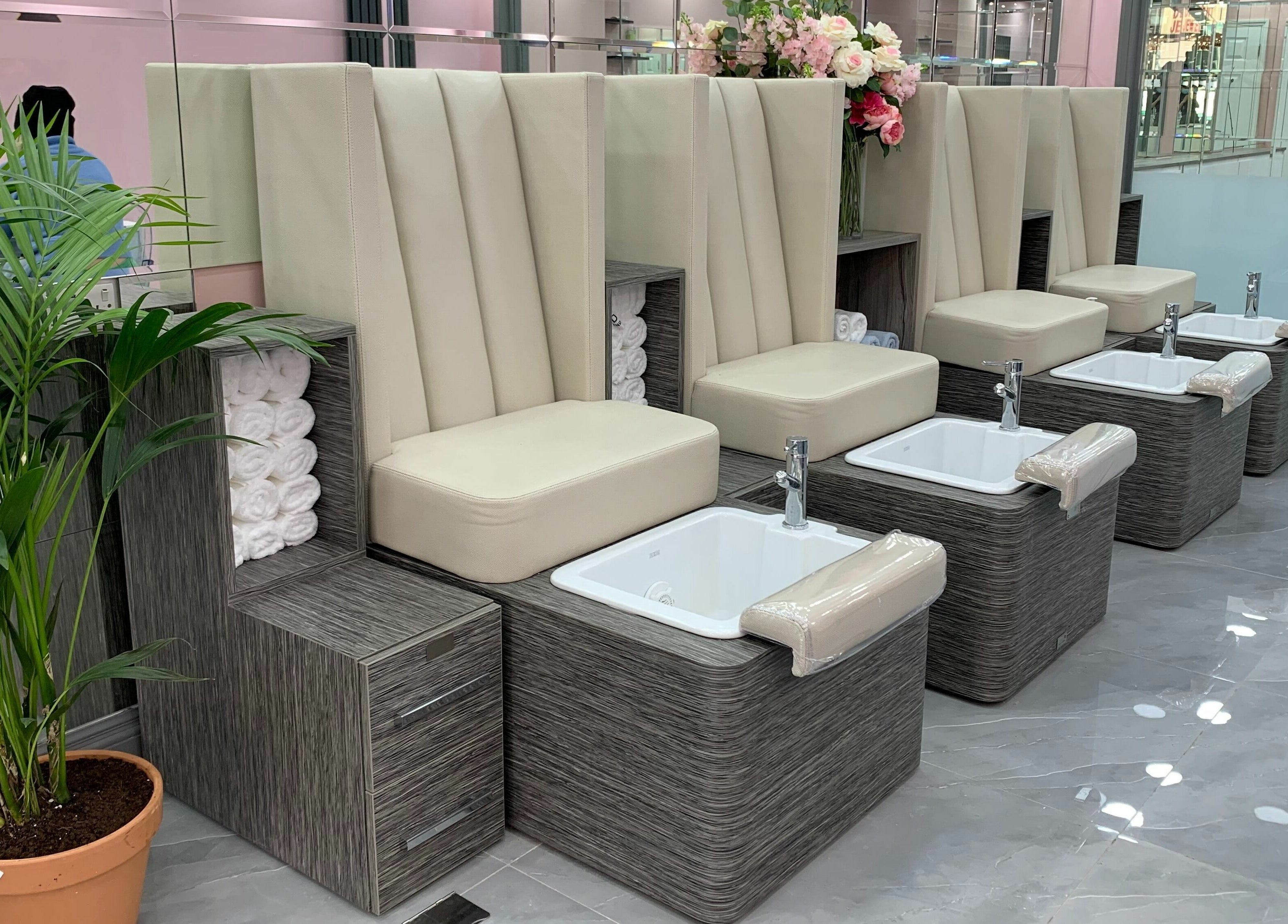 Luxurious pedicure station at Sudan Angel, London, England, GB with plush seating and elegant decor.