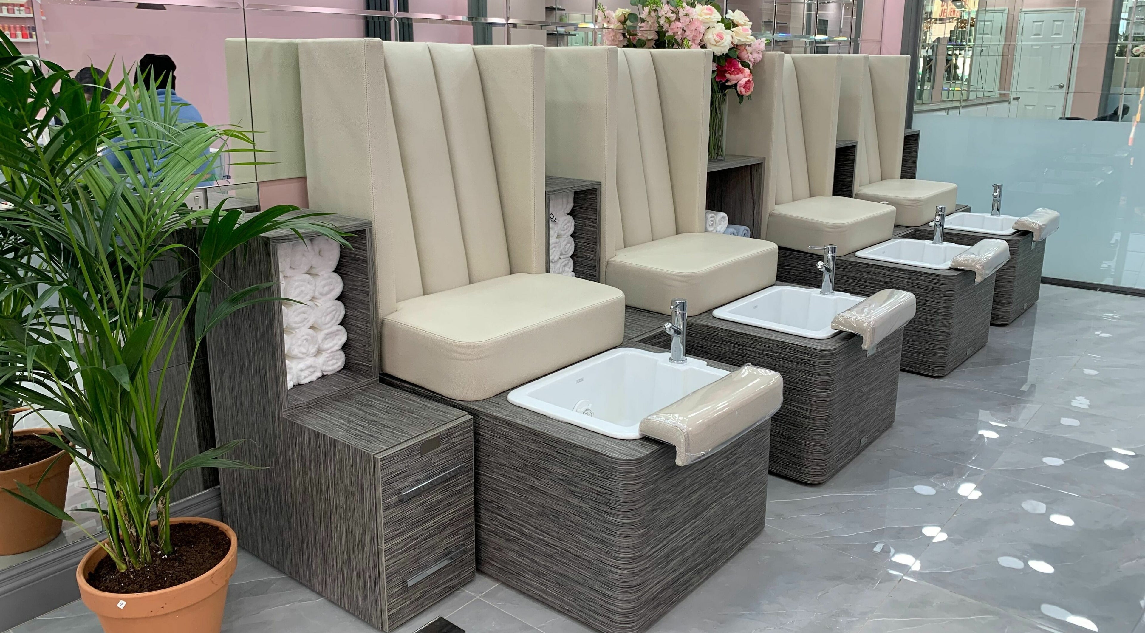 Luxurious pedicure station at Sudan Angel, London, England, GB with plush seating and elegant decor.