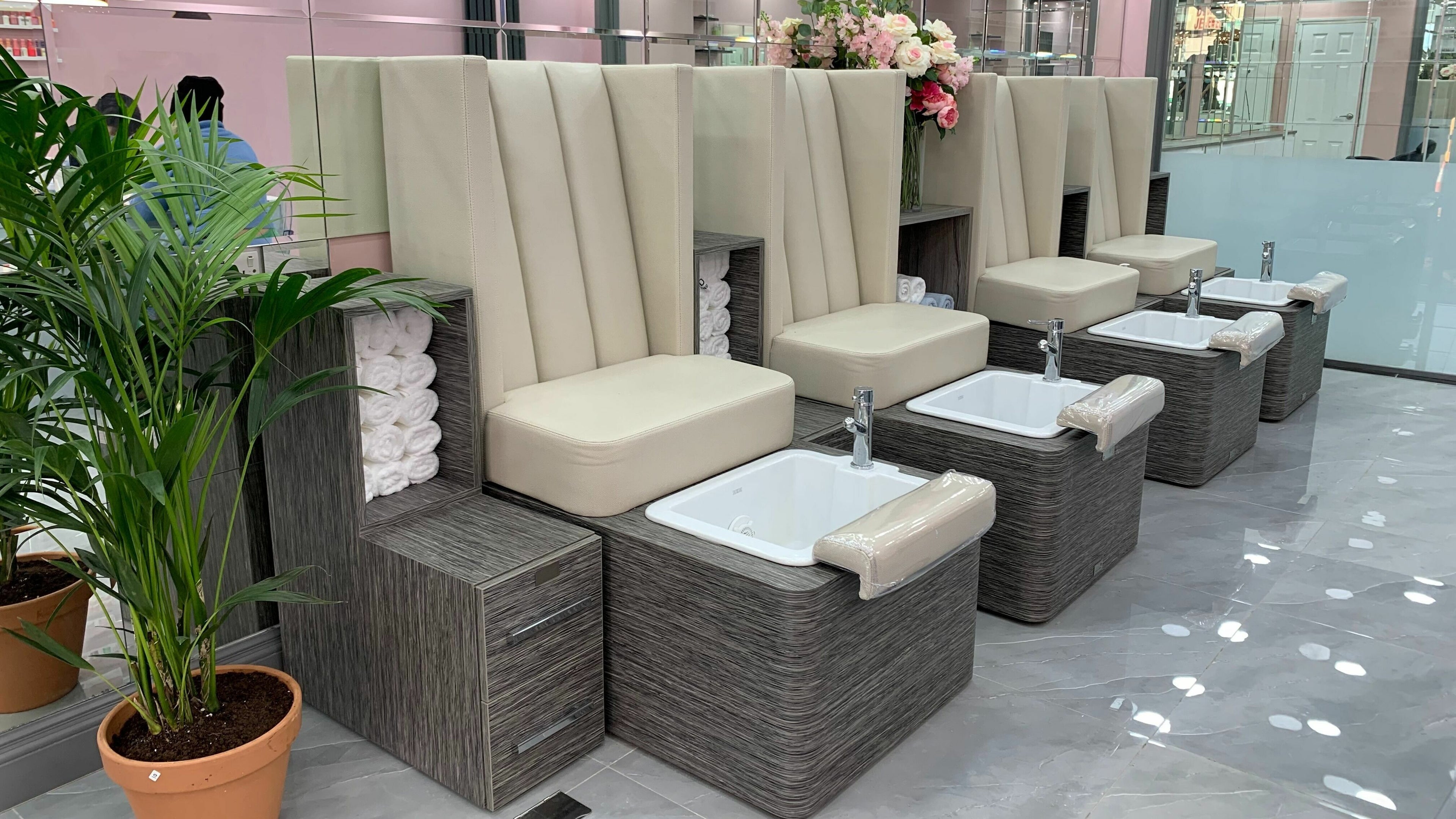 Luxurious pedicure station at Sudan Angel, London, England, GB with plush seating and elegant decor.