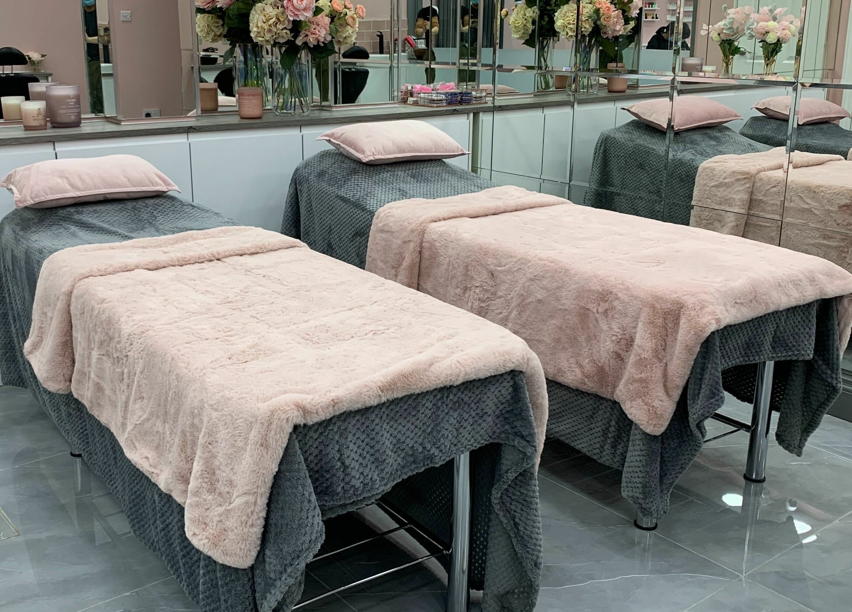 Cozy spa beds with plush covers at Sudan Angel, London, England, GB. Perfect for relaxation and beauty treatments.