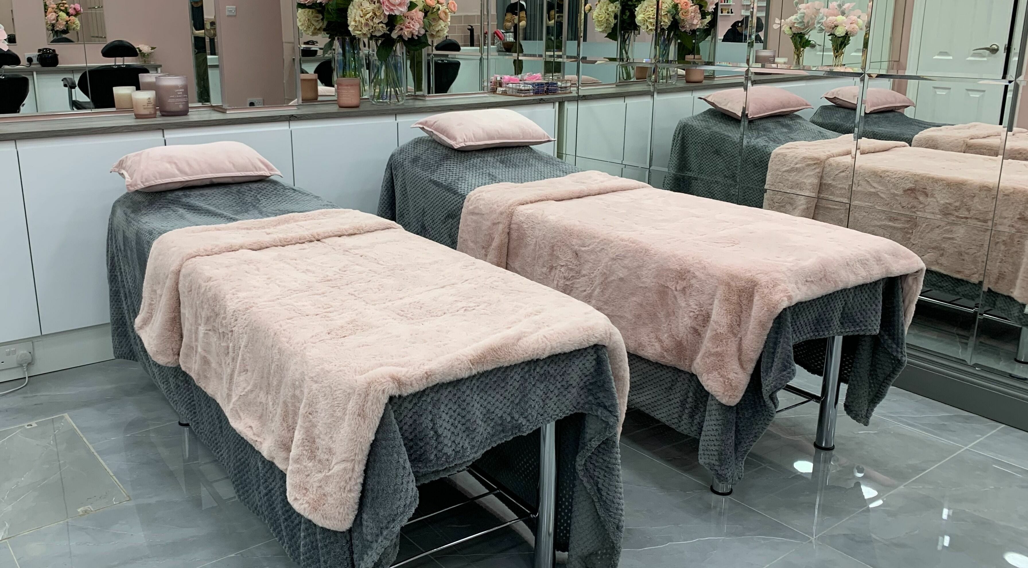 Cozy spa beds with plush covers at Sudan Angel, London, England, GB. Perfect for relaxation and beauty treatments.