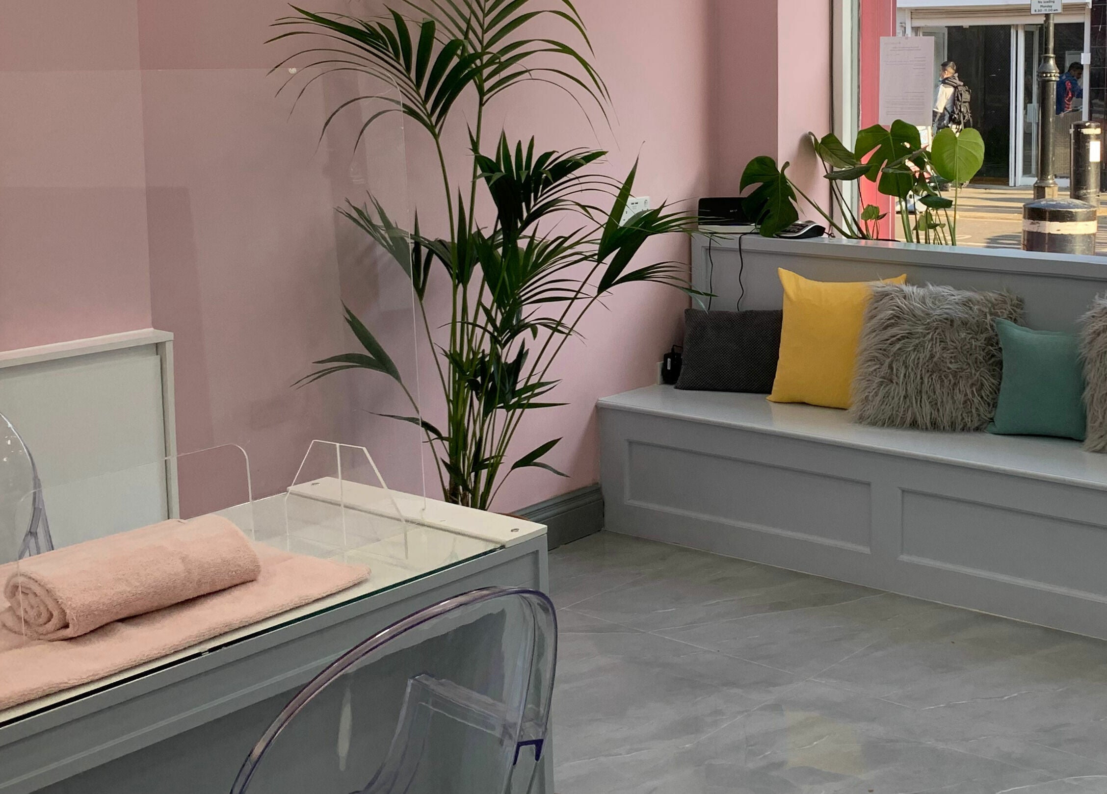 Inviting interior of Sudan Angel in London, England, GB, featuring soft pink walls and plush seating.