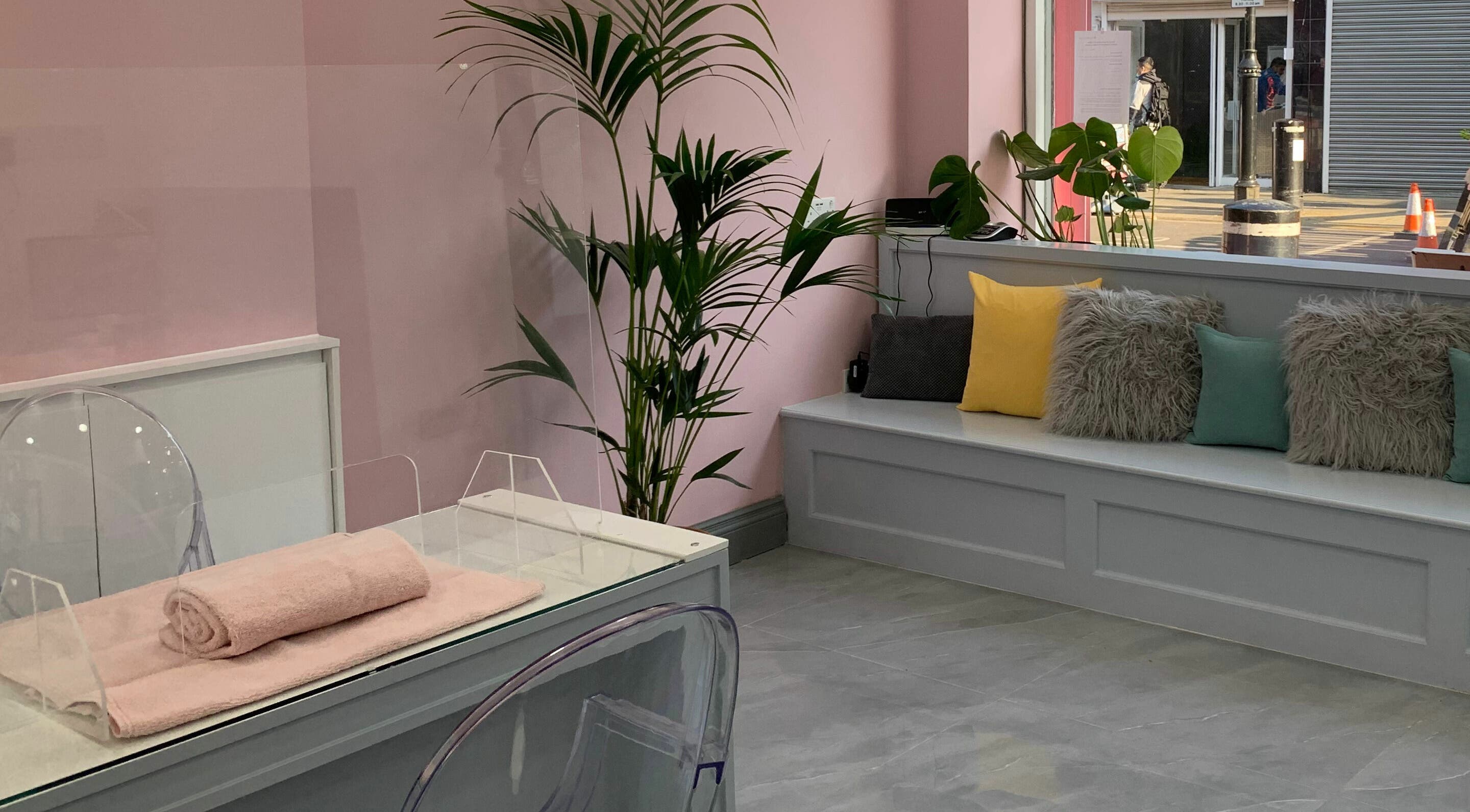 Inviting interior of Sudan Angel in London, England, GB, featuring soft pink walls and plush seating.