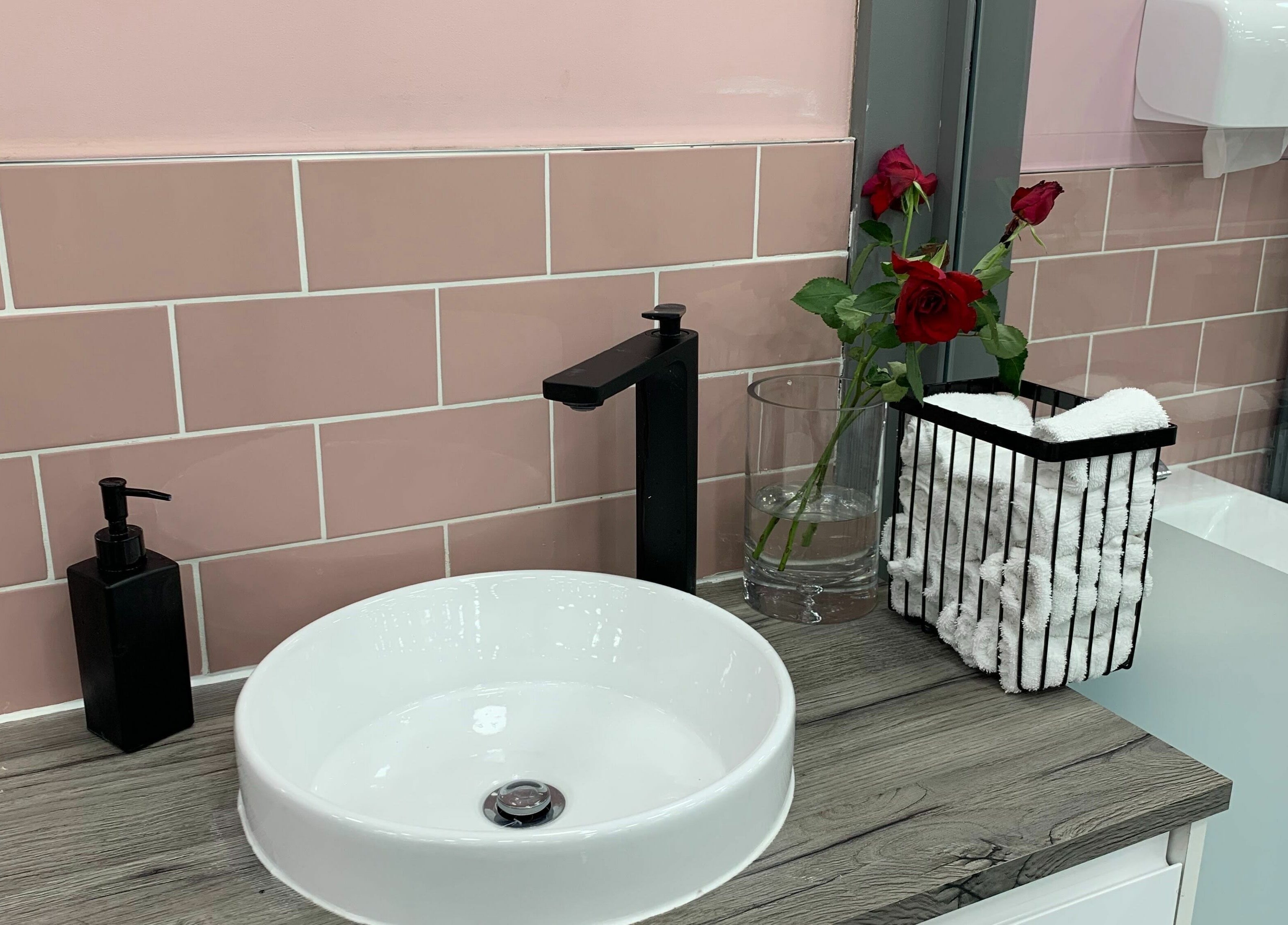 Elegant vanity at Sudan Angel in London, England, GB, featuring a sleek sink and rose decor.