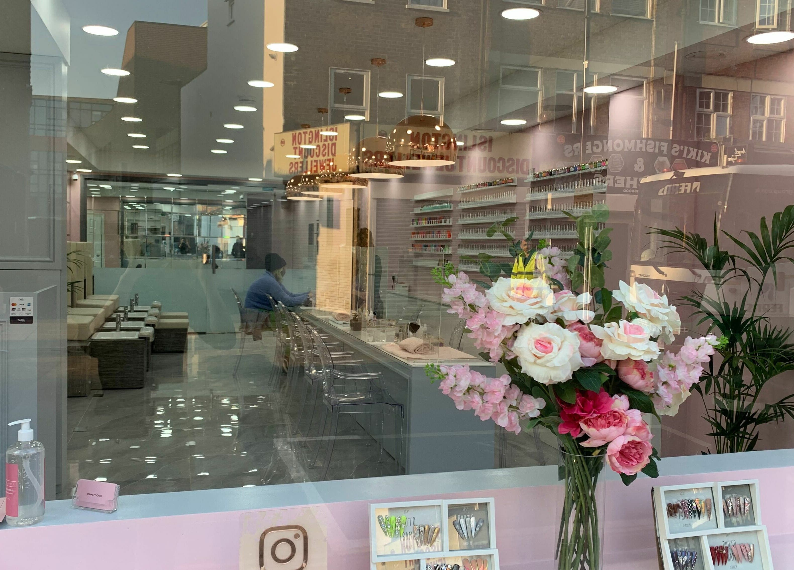 Elegant interior of Sudan Angel in London, England, GB with floral display and manicure station.