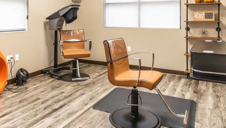 Sleek salon chairs at Its Personal the Salon, Pearland, Texas, US on elegant wood flooring.