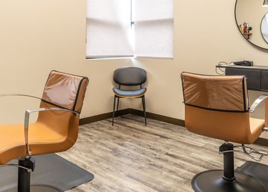 Modern styling chairs at Its Personal the Salon, Pearland, Texas, US, showcasing sleek design and comfort.