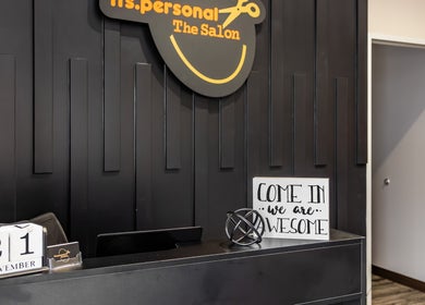 Reception area at Its Personal the Salon in Pearland, Texas, showcasing modern design and inviting decor.