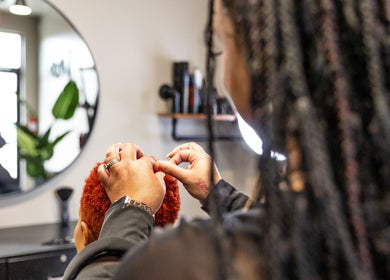 Stylist crafting a hairstyle at Its Personal the Salon in Pearland, Texas, US.
