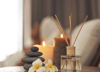 Serene spa setup at InsideOut - Body Therapy, Edenvale, Gauteng, ZA. Featuring candles and smooth stones.