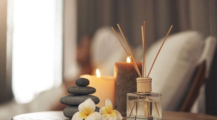 Serene spa setup at InsideOut - Body Therapy, Edenvale, Gauteng, ZA. Featuring candles and smooth stones.