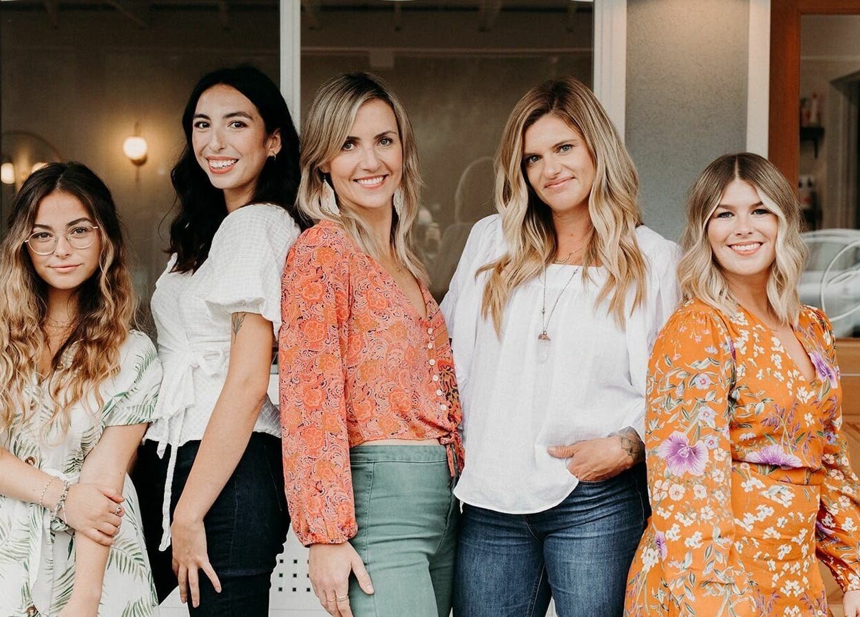 Staff at Boheme in Ojai, California, US, smiling in front of the venue entrance.