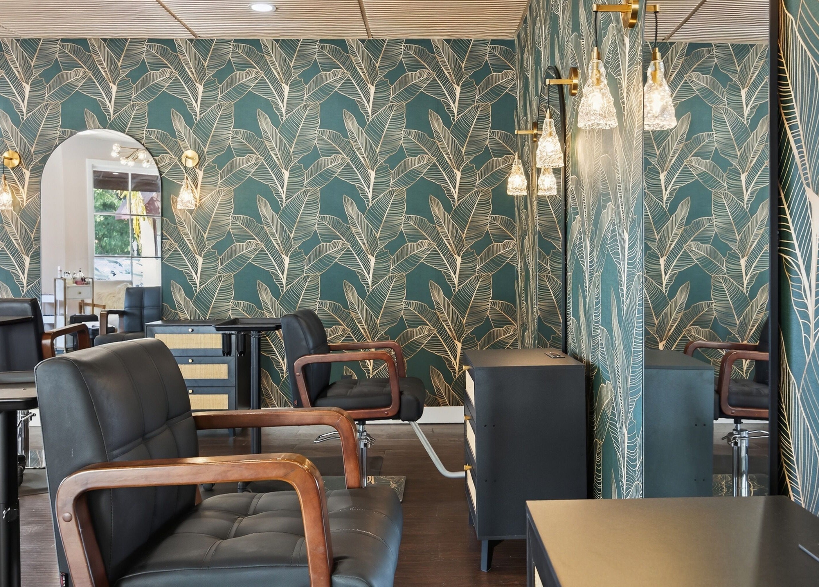 Stylish interior at Bijou with leafy wallpaper in Ojai, California, US.