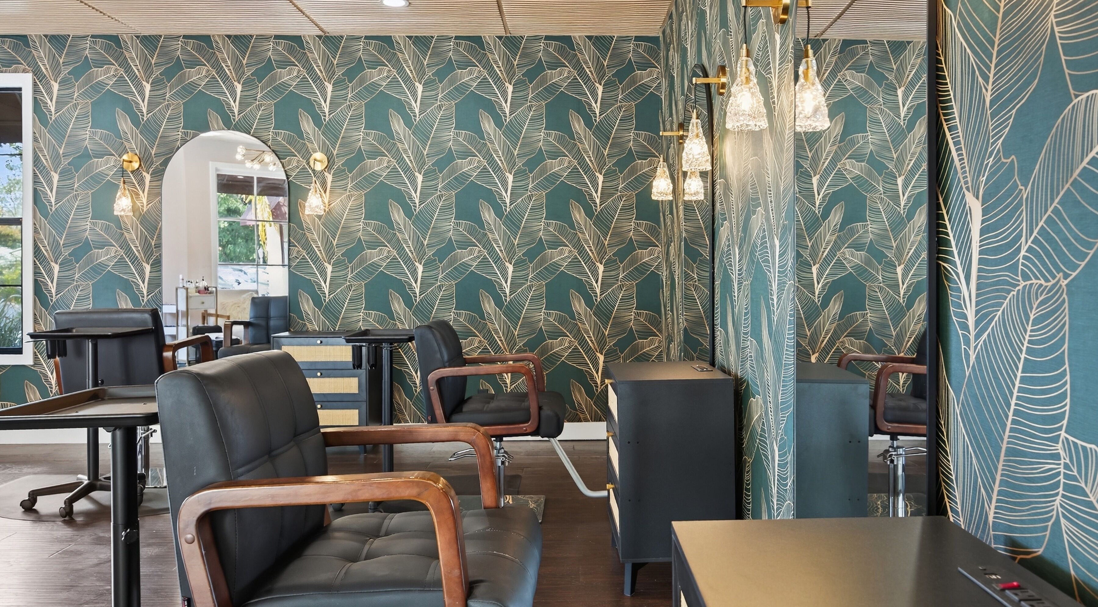 Stylish interior at Bijou with leafy wallpaper in Ojai, California, US.
