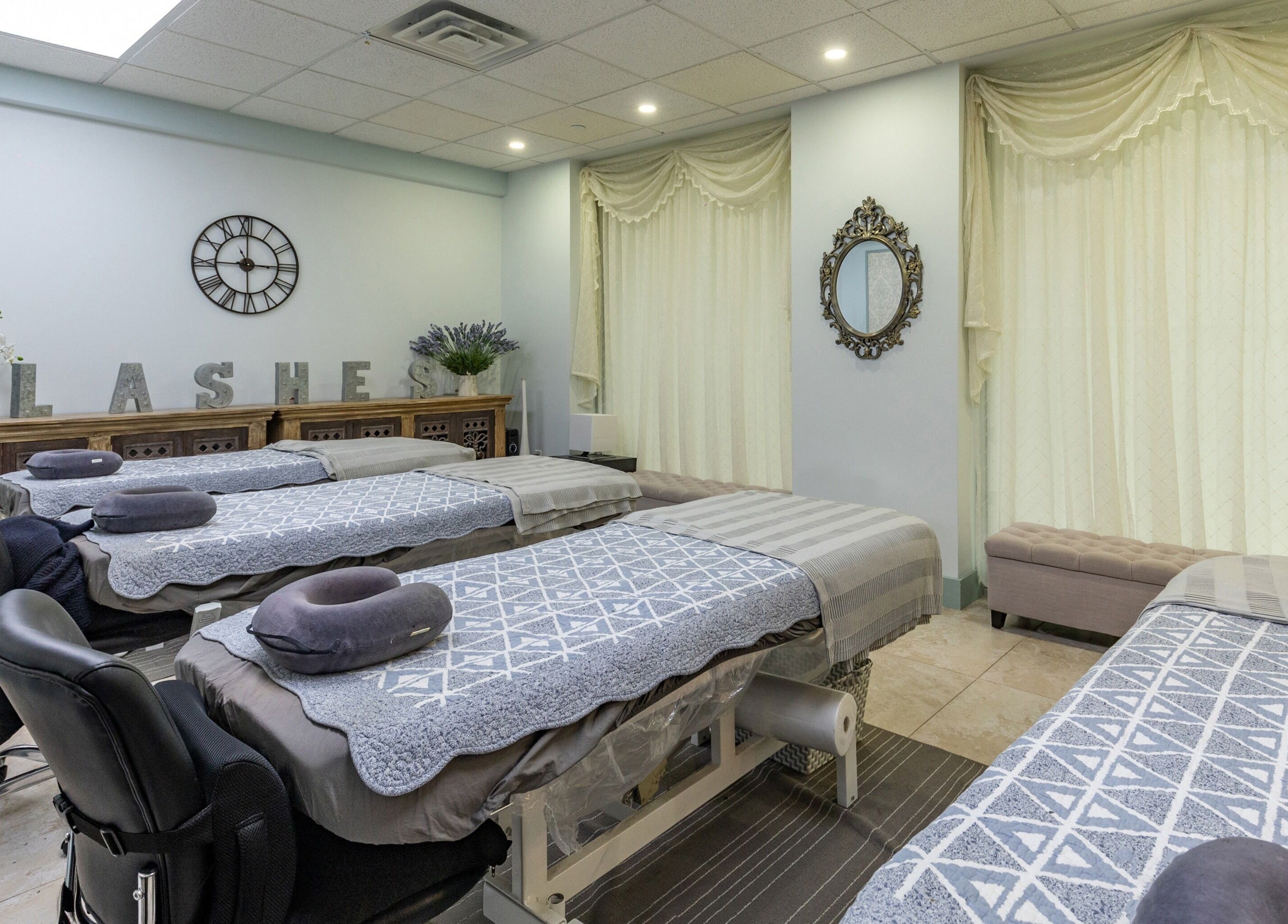 Relaxing interior of Cilium Lash Studio in New York, New York, US, showcasing treatment beds and decor.