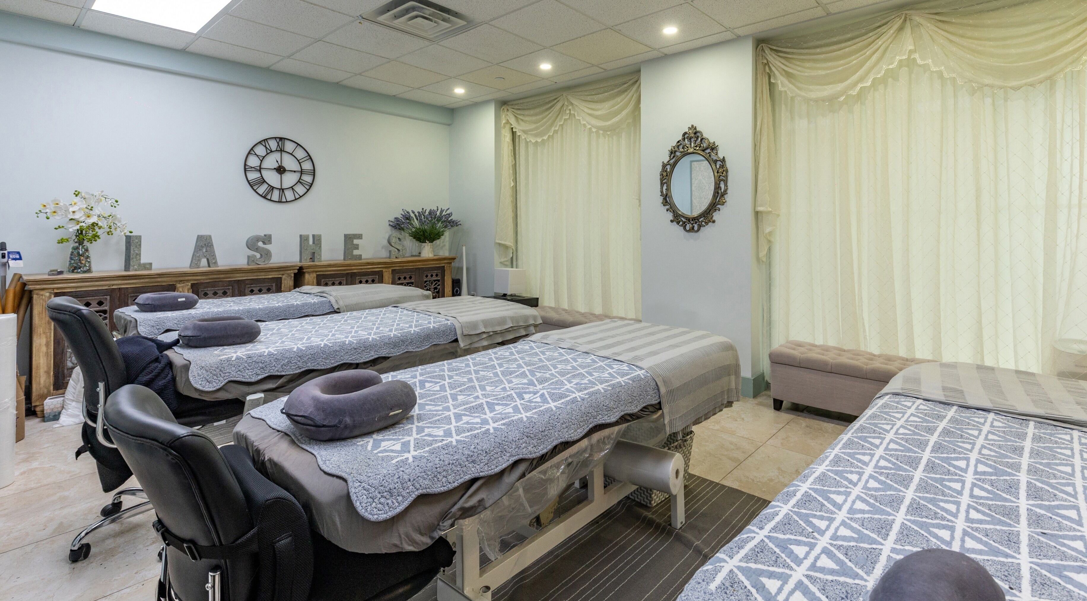 Relaxing interior of Cilium Lash Studio in New York, New York, US, showcasing treatment beds and decor.