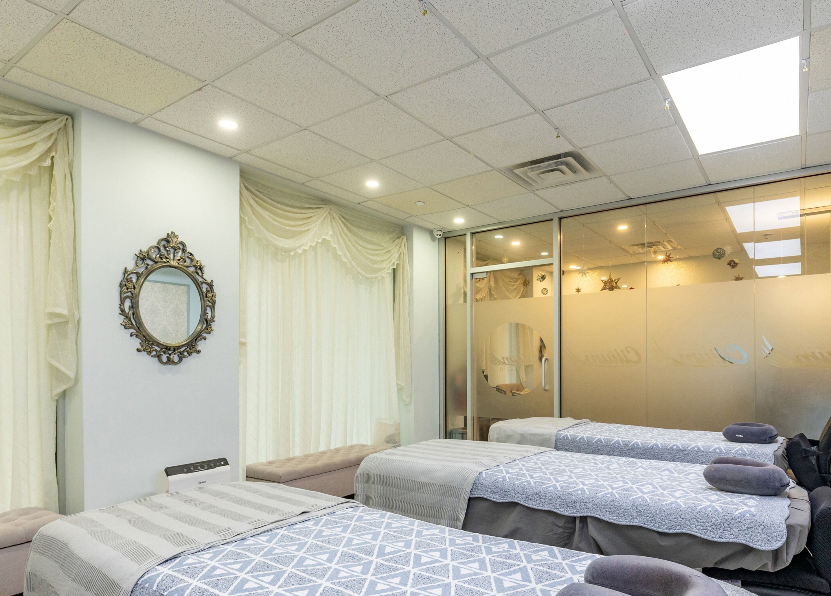 Luxurious treatment room at Cilium Lash Studio, New York, New York, US with elegant decor and cozy beds.