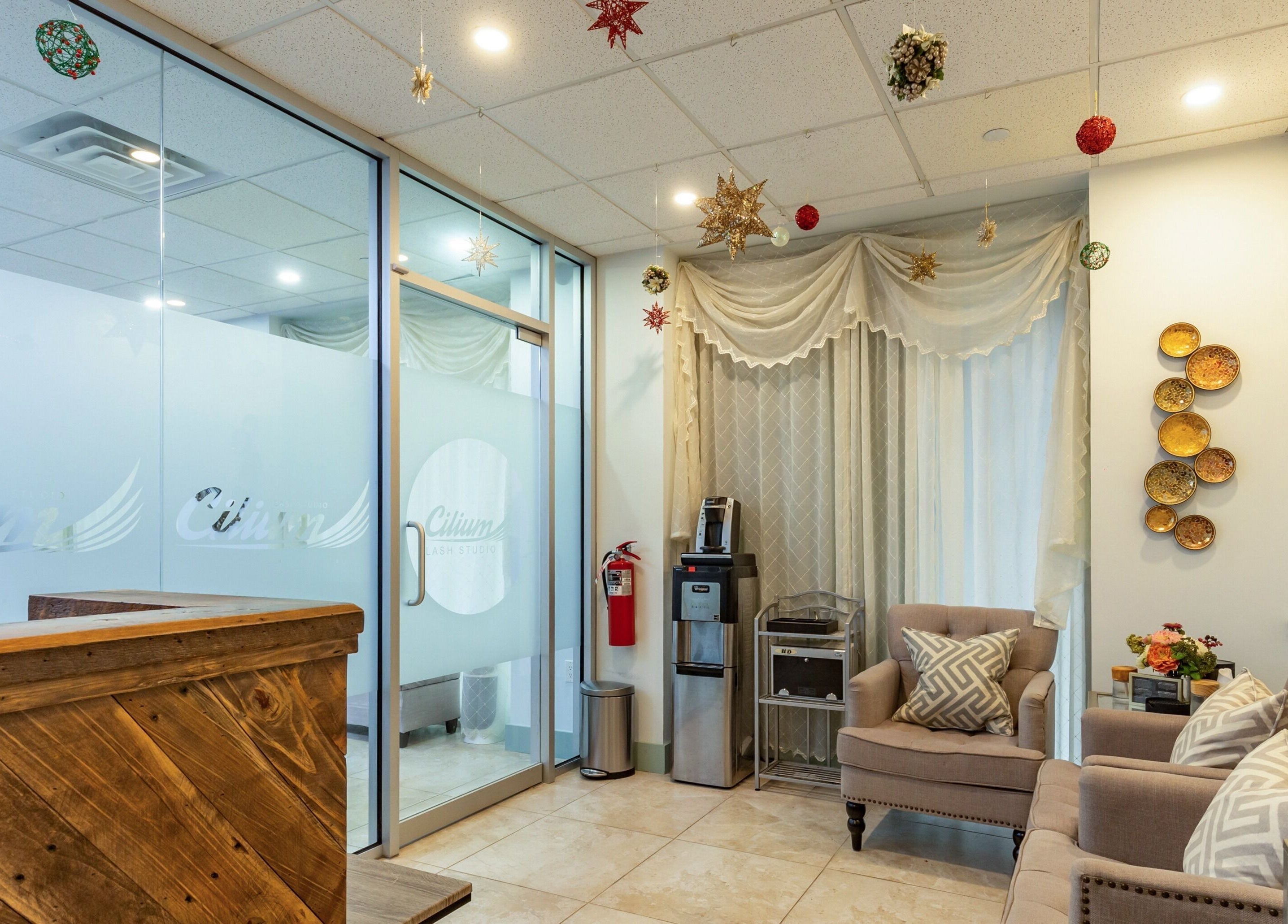 Inviting interior of Cilium Lash Studio, New York, New York, US with plush seating and elegant decor.