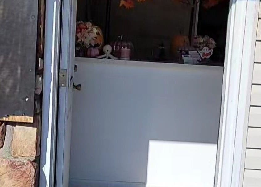 View of Doll Houz Nail Suite entrance in Conway, Arkansas, US with warm seasonal decor.