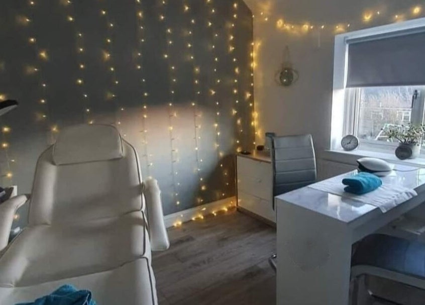 Tranquil treatment room at Alchemy Beauty, Southport, England, GB with cozy lighting and modern decor.
