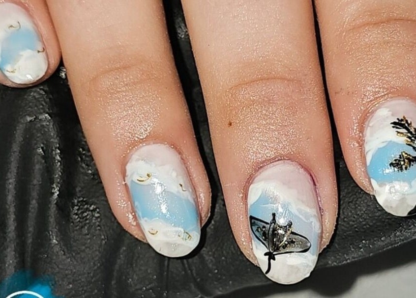 Intricate nail art at Alchemy Beauty, Southport, England, GB featuring sky and tree designs.