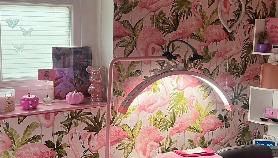 Stylish beauty space at Lashes By Leesh Witney, decorated with flamingo wallpaper in Witney, England, GB.