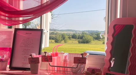 A scenic view from inside 'Lashes by Leesh Bledington', Chipping Norton, England, GB, showcasing pricing and beauty supplies.