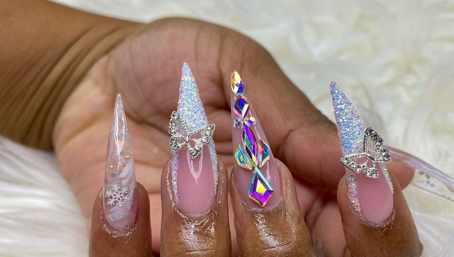 Intricate butterfly and snowflake nail art at Glam Nails by Sharon Melamu, Kuruman, Northern Cape, ZA.