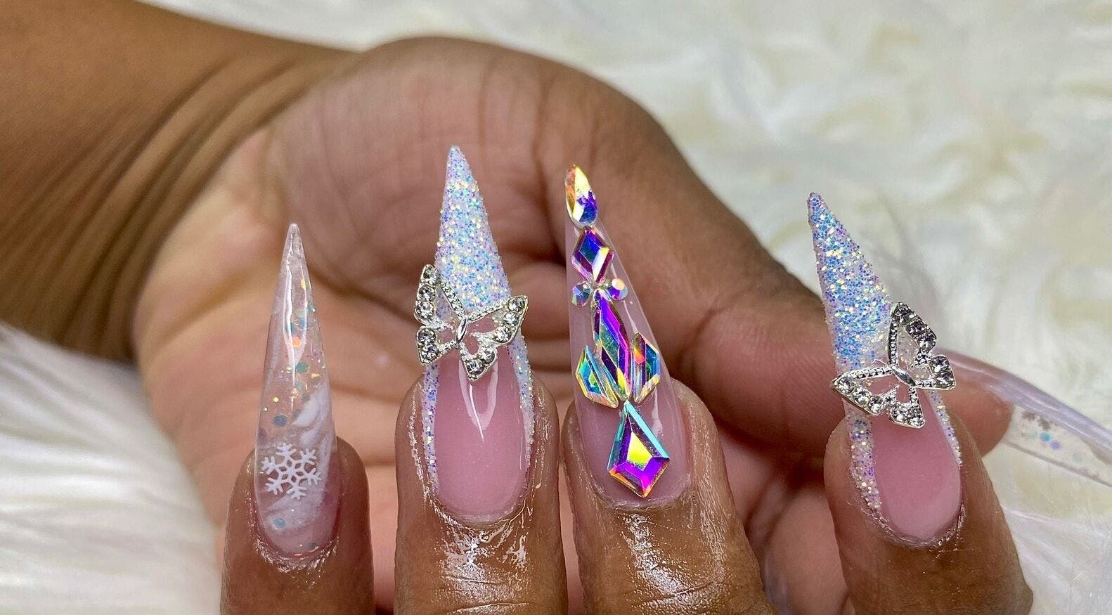 Intricate butterfly and snowflake nail art at Glam Nails by Sharon Melamu, Kuruman, Northern Cape, ZA.