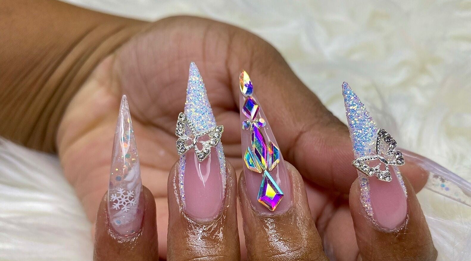 Intricate butterfly and snowflake nail art at Glam Nails by Sharon Melamu, Kuruman, Northern Cape, ZA.