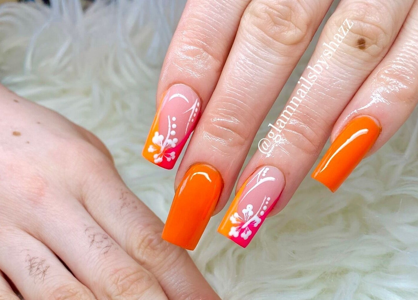 Vibrant manicured nails with floral art at Glam Nails by Sharon Melamu, Kuruman, Northern Cape, ZA.